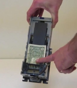 Removing a jammed bill or coin from a MEI series 2000 validator